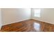 Bright bedroom featuring a window with blinds and laminate flooring at 2451 N Rainbow Blvd # 1116, Las Vegas, NV 89108