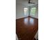 Cozy bedroom with ample natural light and rich hardwood floors for a warm and inviting atmosphere at 3930 Starfield Ln, Las Vegas, NV 89147