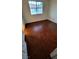 Bedroom with hardwood flooring and a window that provides natural lighting at 3930 Starfield Ln, Las Vegas, NV 89147