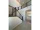 Stylish staircase features modern horizontal railings and leads to a bright, open living space at 560 Preston Oak Pl, Las Vegas, NV 89138
