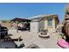 Backyard with a covered patio, shed, fire pit, and outdoor seating at 5929 Caddy Ridge St, North Las Vegas, NV 89031