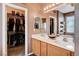 Bathroom featuring a dual sink vanity and a closet at 5929 Caddy Ridge St, North Las Vegas, NV 89031