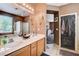 Bathroom with a dual sink vanity, a shower-tub and a decorative mirror at 5929 Caddy Ridge St, North Las Vegas, NV 89031