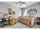 Bedroom with daybed, desk, ceiling fan, and decorative rug at 5929 Caddy Ridge St, North Las Vegas, NV 89031
