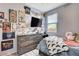 Bedroom featuring a queen bed, television, and decorative posters at 5929 Caddy Ridge St, North Las Vegas, NV 89031