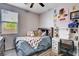 Well-lit bedroom with a comfortable bed, desk, and stylish decor at 5929 Caddy Ridge St, North Las Vegas, NV 89031