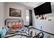 Simple bedroom featuring a metal bed frame and modern decor at 5929 Caddy Ridge St, North Las Vegas, NV 89031