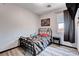 Simple bedroom featuring a metal bed frame and modern decor at 5929 Caddy Ridge St, North Las Vegas, NV 89031