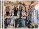 Walk-in closet featuring multiple clothing racks and built-in shelves at 5929 Caddy Ridge St, North Las Vegas, NV 89031