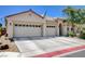 A charming single-story house featuring a three-car garage and well-kept landscaping at 5929 Caddy Ridge St, North Las Vegas, NV 89031