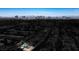 An aerial view of a home featuring the Las Vegas skyline in the background at 6236 Foothill Blvd, Las Vegas, NV 89118