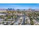 An aerial view of a residential area featuring lush greenery and the Las Vegas skyline at 6236 Foothill Blvd, Las Vegas, NV 89118