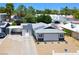 An elevated view of a single-story home with carport, modern solar panels, and desert landscaping at 6236 Foothill Blvd, Las Vegas, NV 89118