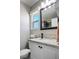 Bathroom featuring granite counters, updated fixtures, and a decorative mirror at 6236 Foothill Blvd, Las Vegas, NV 89118