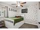 Cozy bedroom with a storage bed, stylish wallpaper, and a ceiling fan at 6236 Foothill Blvd, Las Vegas, NV 89118