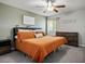 Comfortable bedroom featuring a ceiling fan, large bed, and ample natural light from the window at 6236 Foothill Blvd, Las Vegas, NV 89118