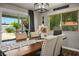 Charming dining area featuring a wooden table, upholstered chairs, and sliding glass door to the patio at 6236 Foothill Blvd, Las Vegas, NV 89118