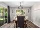 Dining room with a wooden table, seating for six, and sliding glass doors leading to the backyard at 6236 Foothill Blvd, Las Vegas, NV 89118