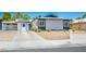 Charming single-story home featuring a covered carport, desert landscaping, and modern solar panels at 6236 Foothill Blvd, Las Vegas, NV 89118