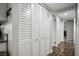 Hallway featuring a closet with white, louvered doors and neutral paint at 6236 Foothill Blvd, Las Vegas, NV 89118