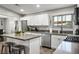 Well-lit kitchen featuring stainless steel appliances, ample counter space and a center island with barstools at 6236 Foothill Blvd, Las Vegas, NV 89118