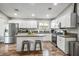 Bright kitchen featuring white cabinets, stainless steel appliances and a center island with seating at 6236 Foothill Blvd, Las Vegas, NV 89118