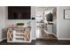 View of an entertainment center dividing the living room from a modern kitchen at 6236 Foothill Blvd, Las Vegas, NV 89118