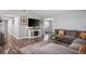 Open floor plan living room featuring a gray sectional and a view of the television at 6236 Foothill Blvd, Las Vegas, NV 89118