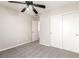 Bedroom with neutral walls, carpeted floor, ceiling fan and a closet with sliding doors at 6548 Butterfly Sky St, North Las Vegas, NV 89084