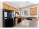 Efficient kitchen with sleek black appliances and durable countertops at 6548 Butterfly Sky St, North Las Vegas, NV 89084