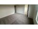 This bedroom boasts neutral walls and plush carpet, awaiting your personal touch to transform it into a cozy retreat at 6604 Bowery St, Las Vegas, NV 89148