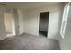 Spacious bedroom filled with natural light with plush carpet, awaiting your personal touch to transform it at 6604 Bowery St, Las Vegas, NV 89148