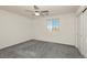 This bedroom has neutral paint, carpet, ceiling fan, and a window with exterior view at 675 Omaggio Pl, Henderson, NV 89011