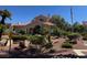 Exterior view of the community clubhouse featuring lush landscaping at 7905 Ryandale Cir # 201, Las Vegas, NV 89145