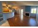 Open living room boasts lots of natural light, fireplace, kitchen access, and sliding doors at 7905 Ryandale Cir # 201, Las Vegas, NV 89145