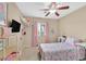 Bright bedroom with a ceiling fan, natural light, and a cozy, comfortable interior design at 8335 Martinborough Ave, Las Vegas, NV 89131