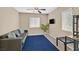 Relaxing living room setup with a plush sofa, blue rug, and natural light at 8335 Martinborough Ave, Las Vegas, NV 89131