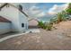 View of the backyard with desert landscaping and a concrete patio outside the home at 860 Bergamont Dr, Henderson, NV 89002