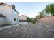 Backyard features low maintenance desert landscaping, a small concrete patio and block wall at 860 Bergamont Dr, Henderson, NV 89002