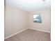 Cozy bedroom featuring neutral walls, plush carpet, and a window view at 860 Bergamont Dr, Henderson, NV 89002