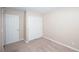 Neutral bedroom features plush carpet, closet with sliding doors and natural light at 860 Bergamont Dr, Henderson, NV 89002
