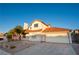 Inviting two-story home featuring a well-maintained lawn and a spacious two-car garage, perfect for comfortable living at 860 Bergamont Dr, Henderson, NV 89002