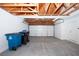 Spacious garage with white walls, a white garage door and a ceiling with exposed beams at 860 Bergamont Dr, Henderson, NV 89002