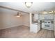 Charming eat-in kitchen with white cabinets, appliances, and ceiling fan at 860 Bergamont Dr, Henderson, NV 89002