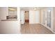 Open concept kitchen nook with white cabinets, tiled floor and bar seating at 860 Bergamont Dr, Henderson, NV 89002