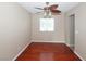 Bright living room offers wood floors, natural light, and a modern ceiling fan for comfortable living at 860 Bergamont Dr, Henderson, NV 89002