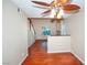Cozy living room features gleaming wood floors, a ceiling fan, and bright natural light at 860 Bergamont Dr, Henderson, NV 89002