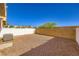 Low maintenance backyard featuring a rock ground cover and a privacy fence at 8842 Duncan Barrel Ave # 103, Las Vegas, NV 89178