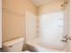 Clean bathroom with bathtub/shower combo, storage shelves, and neutral wall color at 8842 Duncan Barrel Ave # 103, Las Vegas, NV 89178