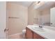 Well-lit bathroom featuring a sink with cabinet and a large mirror for convenience at 8842 Duncan Barrel Ave # 103, Las Vegas, NV 89178